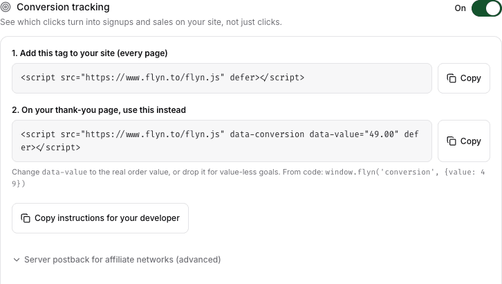 The conversion tracking panel with the toggle on, showing the site tag and the thank-you page tag with copy buttons